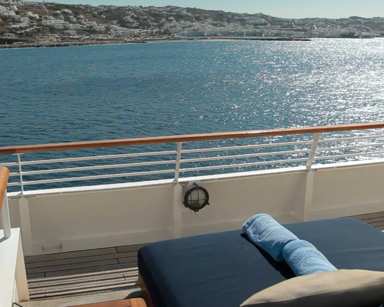 SeaDream Yacht Club Deck View at Sea A luxurious cabin balcony or deck area aboard SeaDream Yacht Club, offering panoramic views