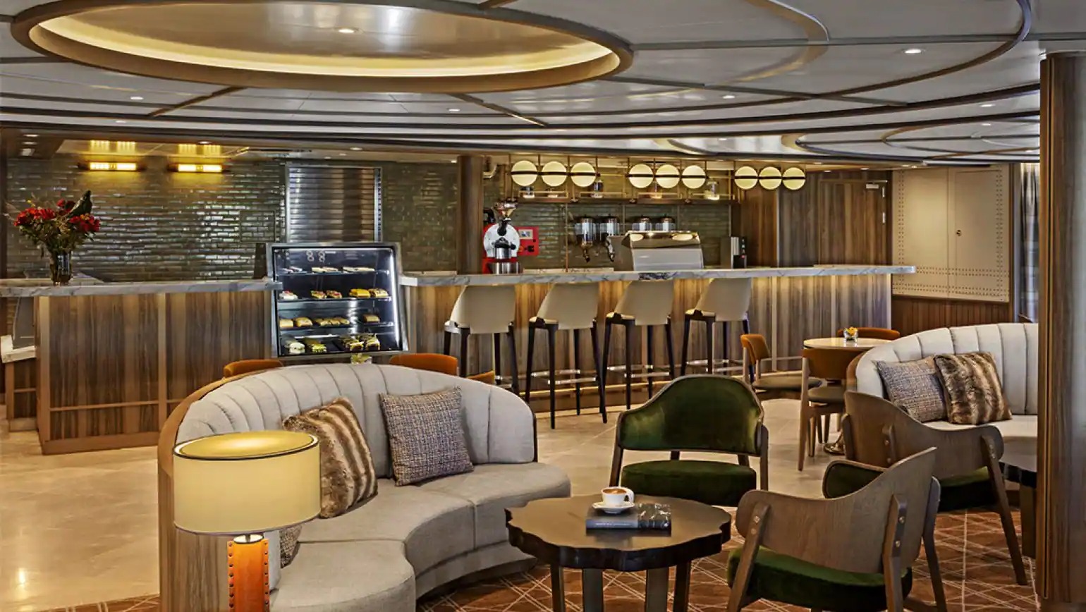 Seabourn Venture Elegant Dining Lounge A luxurious ship dining lounge and bar area featuring contemporary design with warm wood paneling