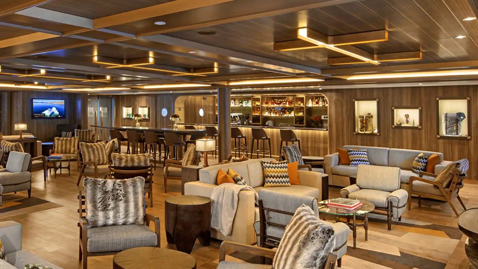 Seabourn Venture Expedition Lounge A sophisticated and elegantly designed expedition lounge aboard the Seabourn Venture, featuring