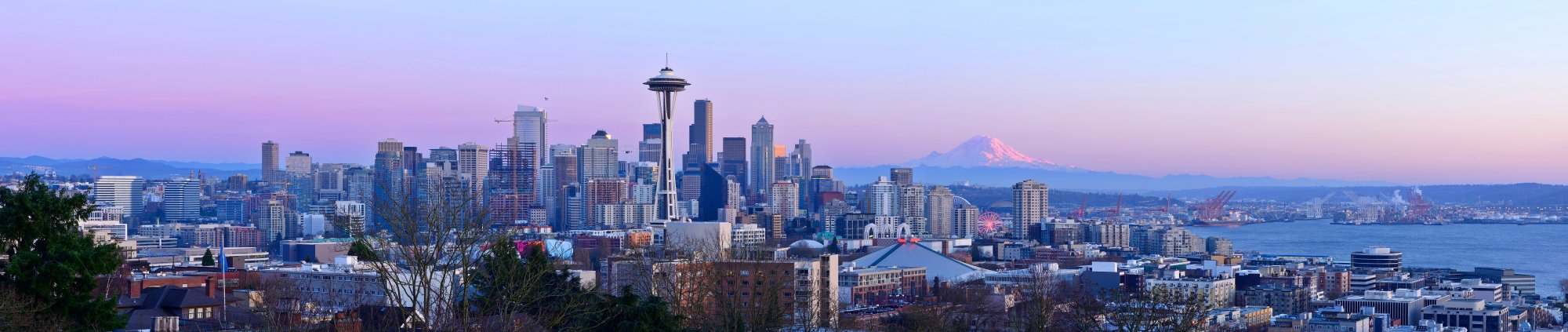 Seattle Skyline at Twilight with Mount Rainier A stunning panoramic view of Seattle's iconic downtown skyline at dusk, featuring the Space Needle