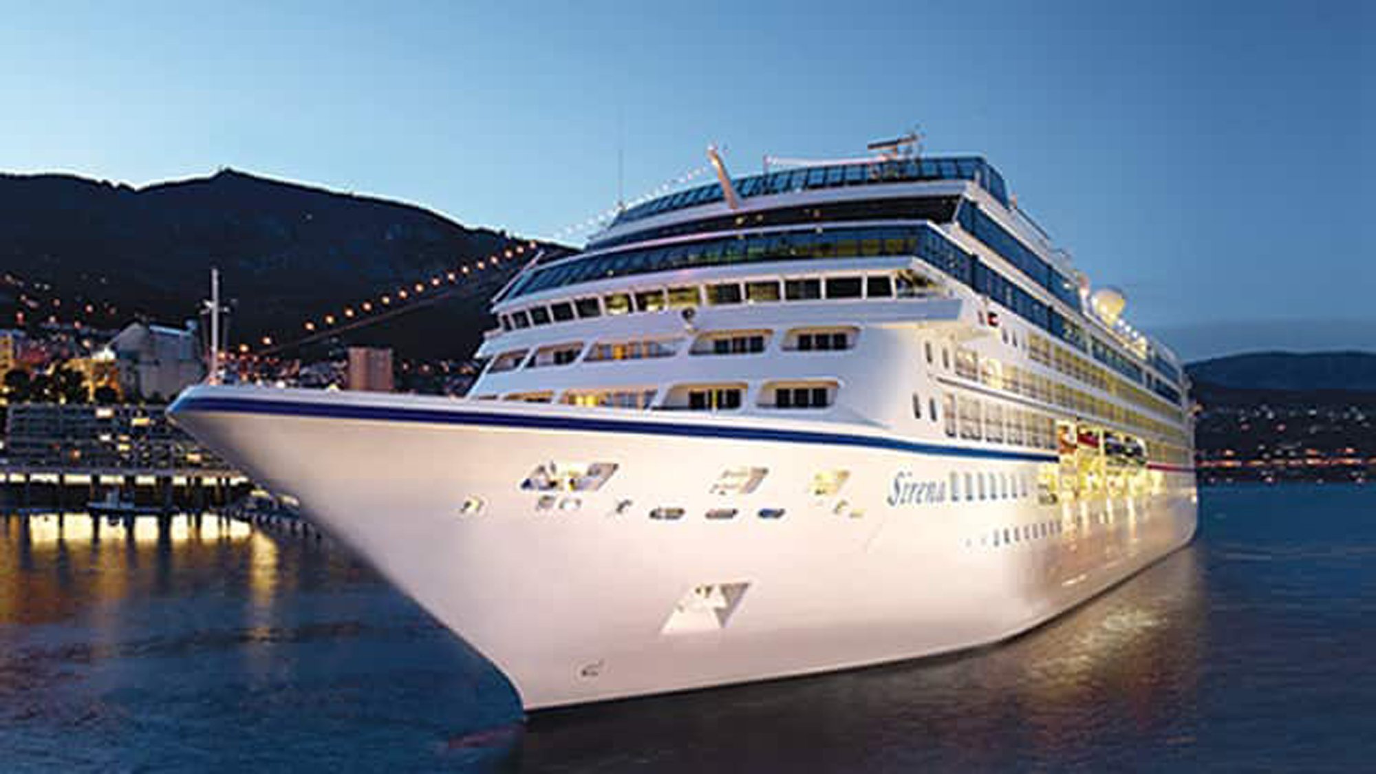 Sirena Cruise Ship Docked at Monte Carlo A luxurious white and blue cruise ship docked at a port in Monte Carlo during twilight