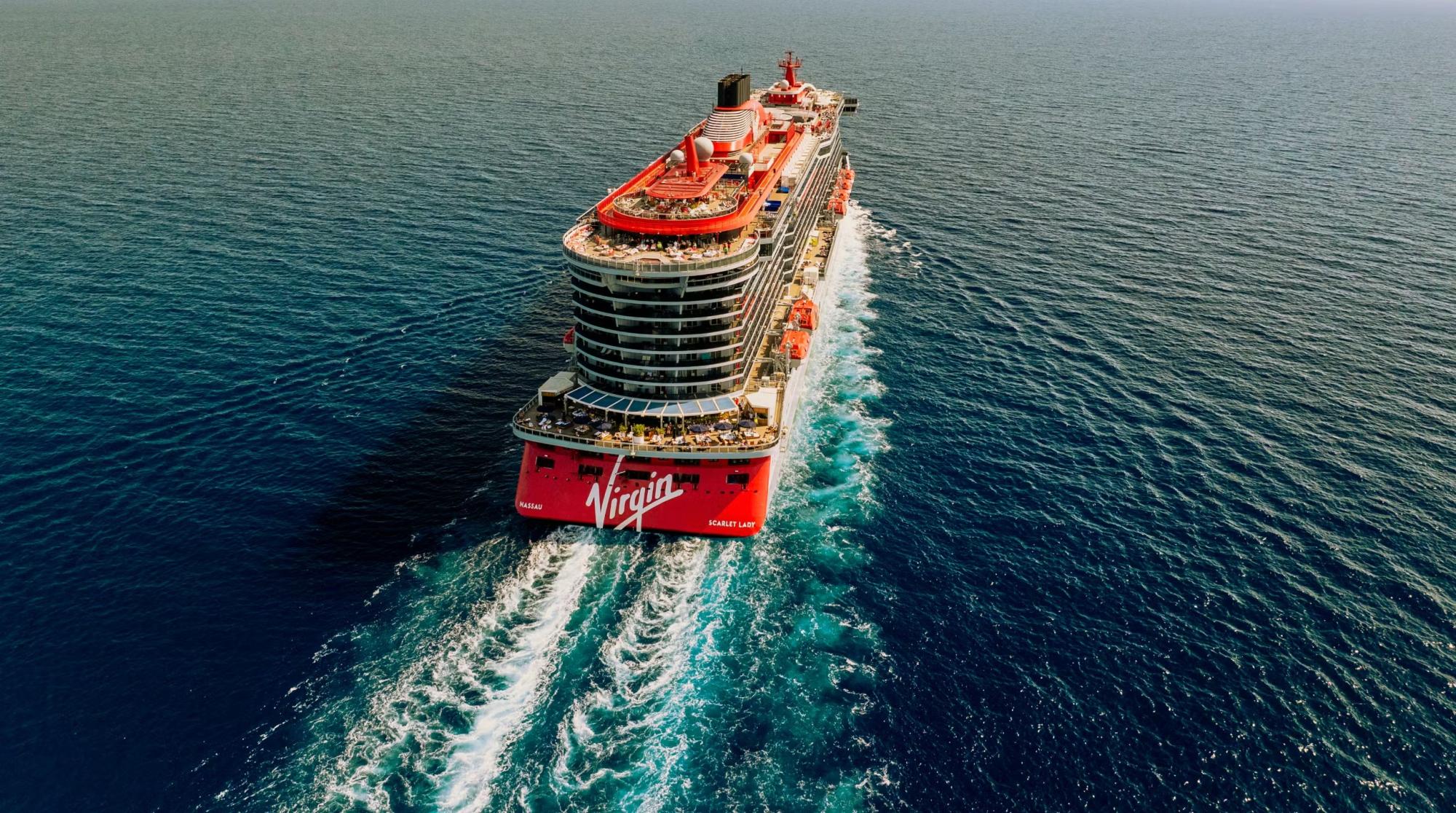 Virgin Voyages Scarlet Lady Cruise Ship at Sea An aerial view of the Virgin Voyages Scarlet Lady cruise ship navigating open ocean waters
