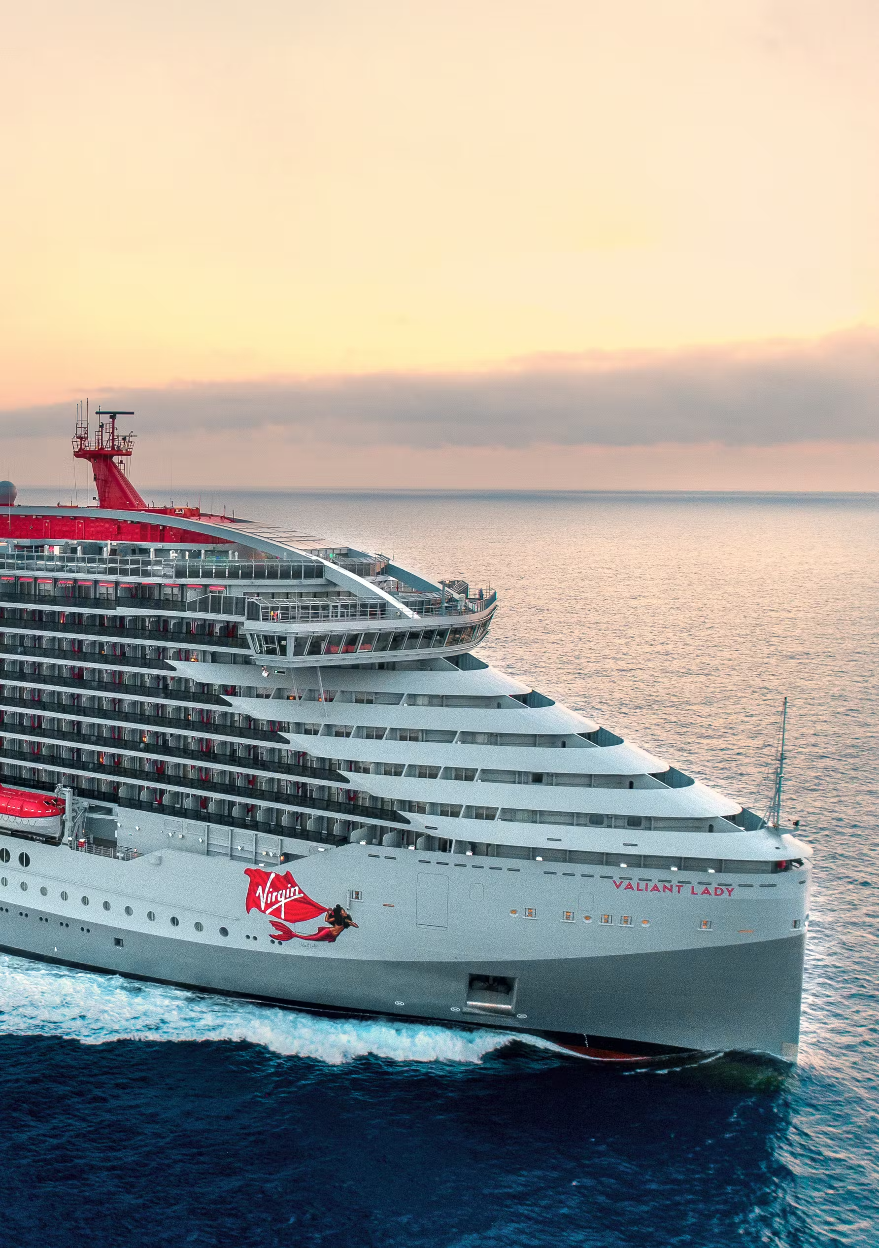 Virgin Voyages Valiant Lady at Sunrise The Valiant Lady, a modern cruise ship operated by Virgin Voyages, is captured in striking detail