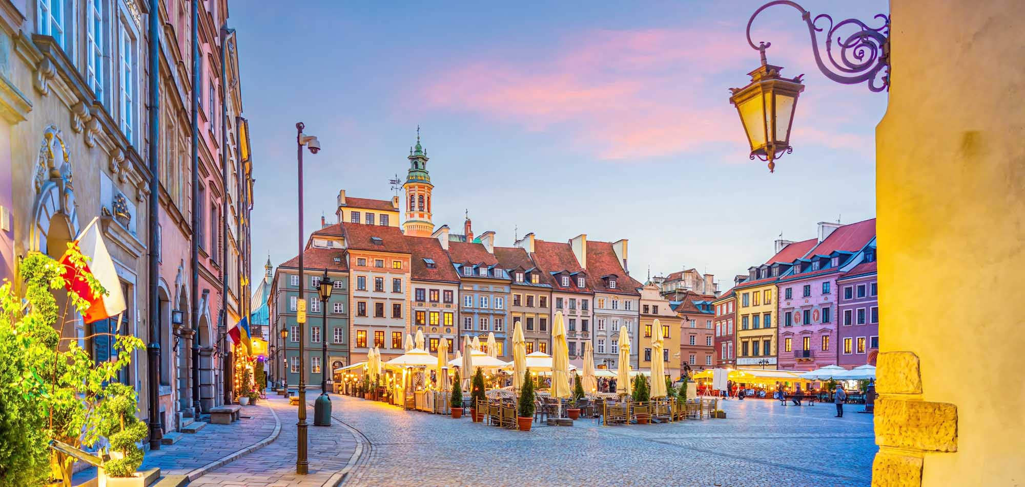 The historic Rynek Starego Miasta (Old Town Market Square) in Warsaw, Poland, illuminated at dusk