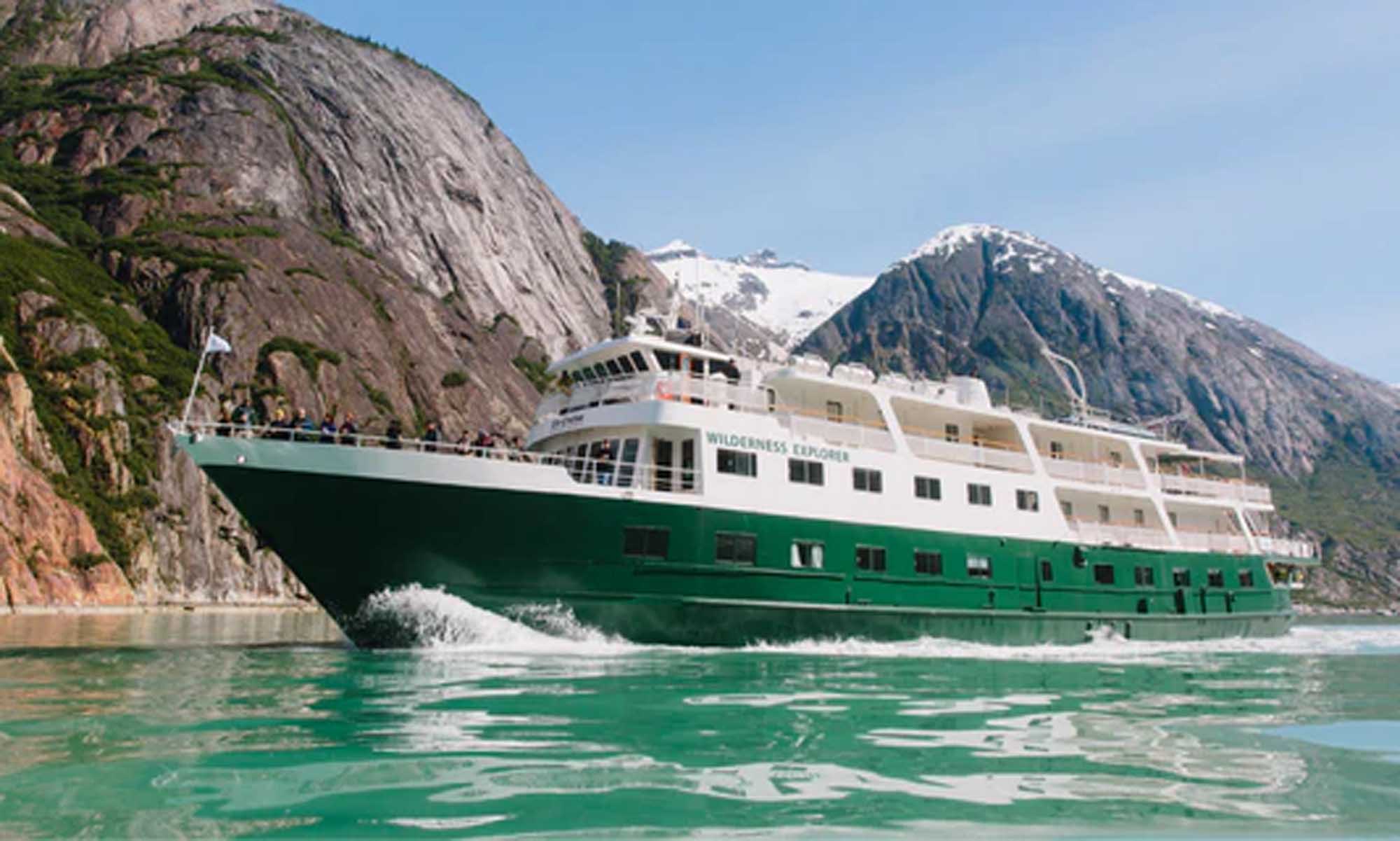 The Wilderness Explorer, a small expedition cruise ship with distinctive green and white hull